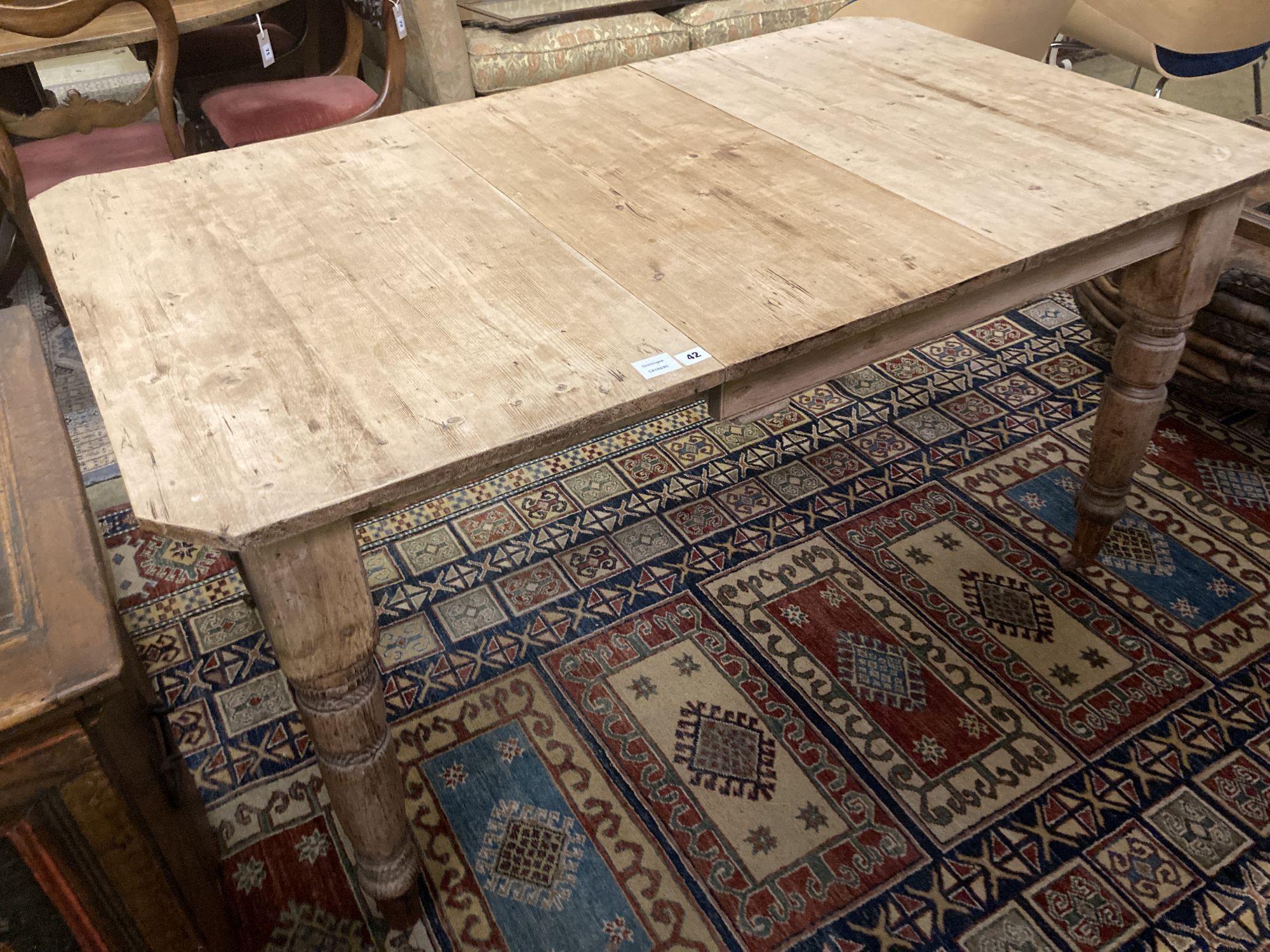 A late Victorian pine extending dining table, 147cm (extended one spare leaf), width 87cm height 76cm